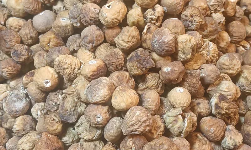 Close-up heap of whole sun-dried figs